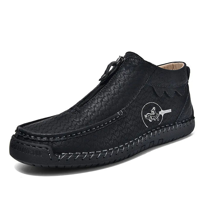 Men's black slip-on loafers with round toe and low heel design showing sewing detail on PU upper