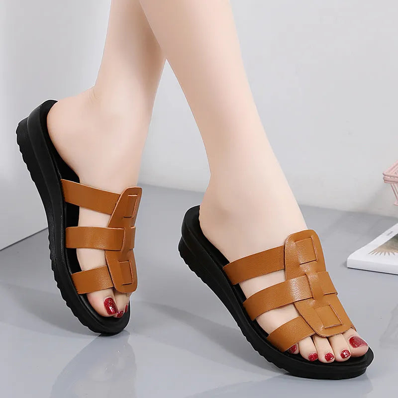 Beige women's flat-bottom slippers with a PU leather toe and soft sole.