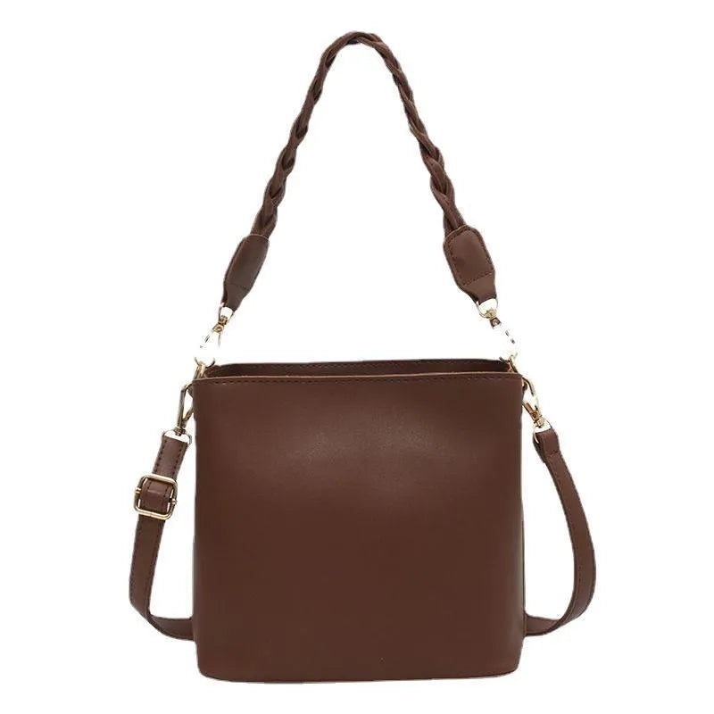 Retro khaki crossbody bucket bag with woven PU detailing and adjustable strap.