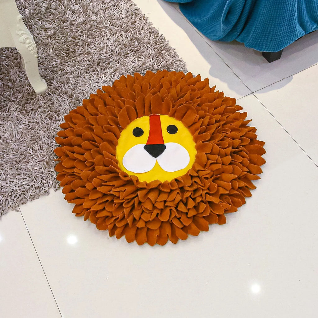 Brown lion face pattern snuffle mat for dogs and cats on a floor.