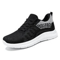 Women's black mesh sneakers with round toe and lace-up design on white background