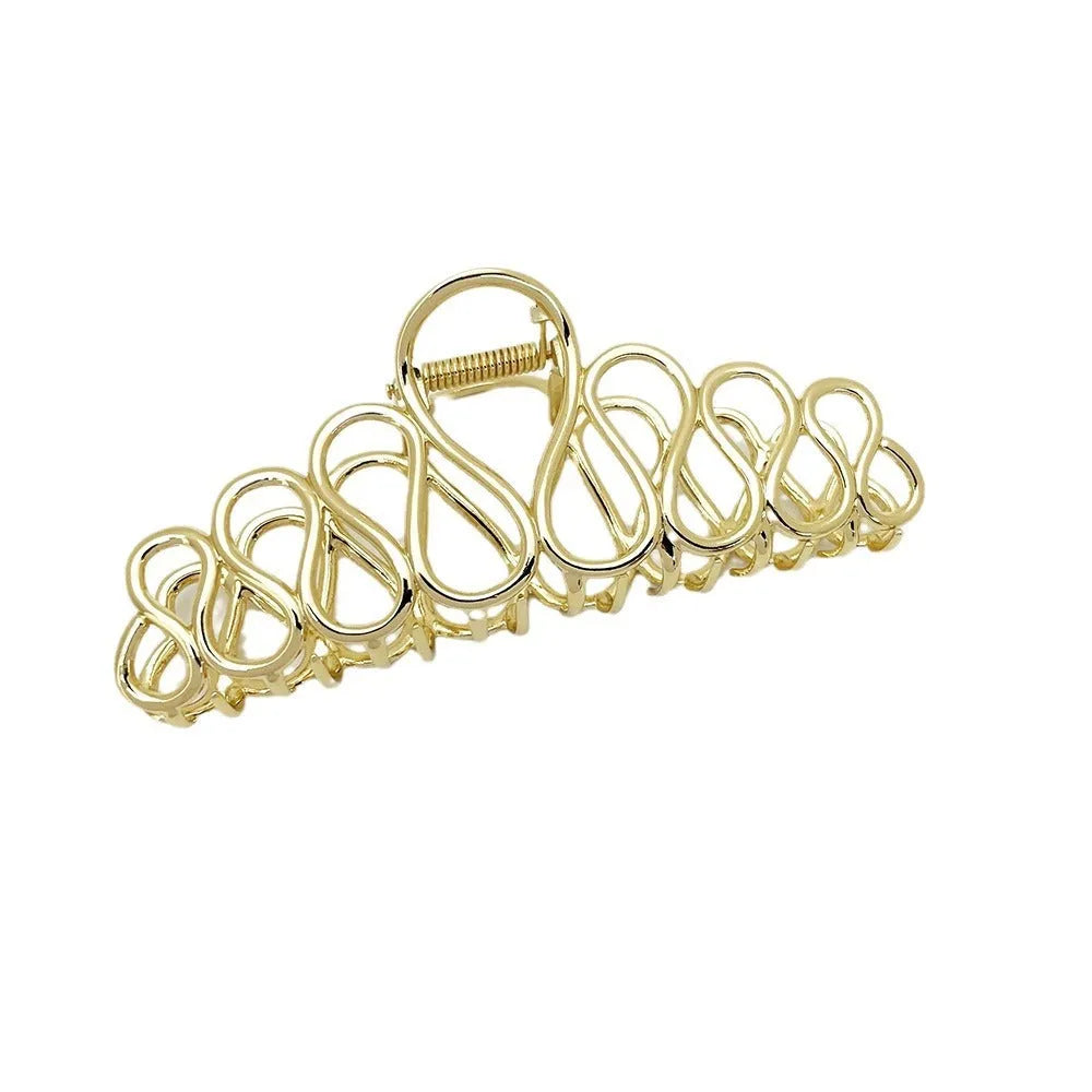 Large alloy hair clip with tassel design in gold electroplated finish for women's updo styling