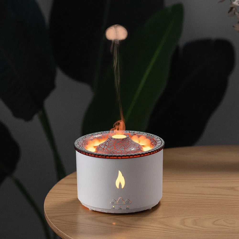 White volcano-shaped humidifier emitting a two-colour mist spray ring.