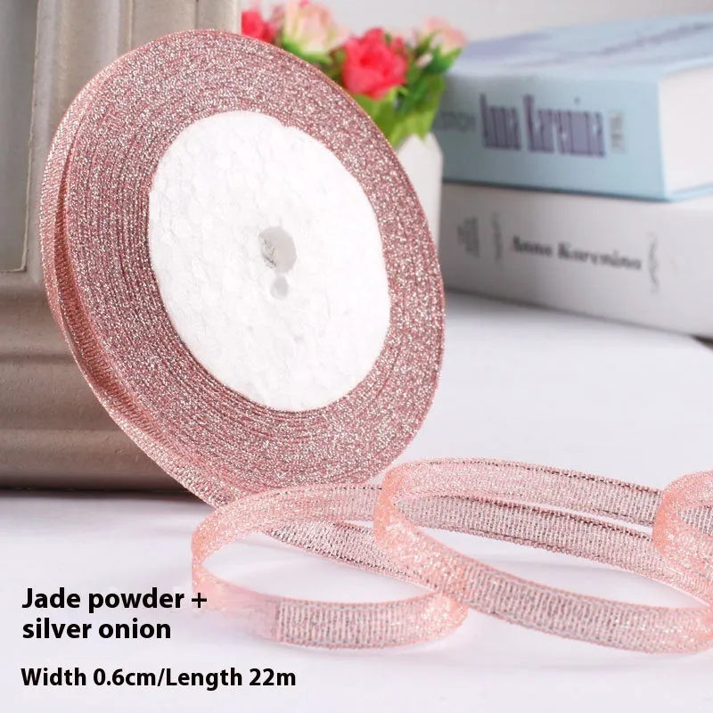 Roll of polyester gift ribbon showing 0.6cm width and multiple colour options including metallic finishes