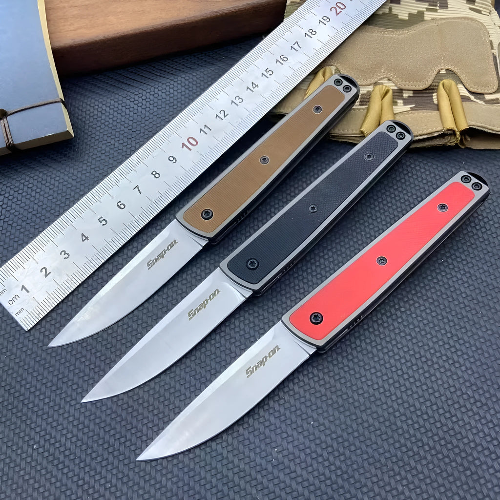 Closed and open views of a black folding fruit knife showing blade and handle.