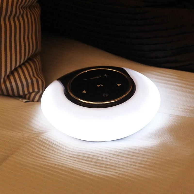 DEAMAK-1 Bluetooth speaker with integrated LED desk lamp showing folding design and touch controls