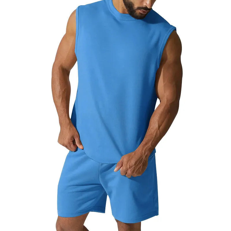 Men's sleeveless cotton blend sports top and shorts set in a solid colour.