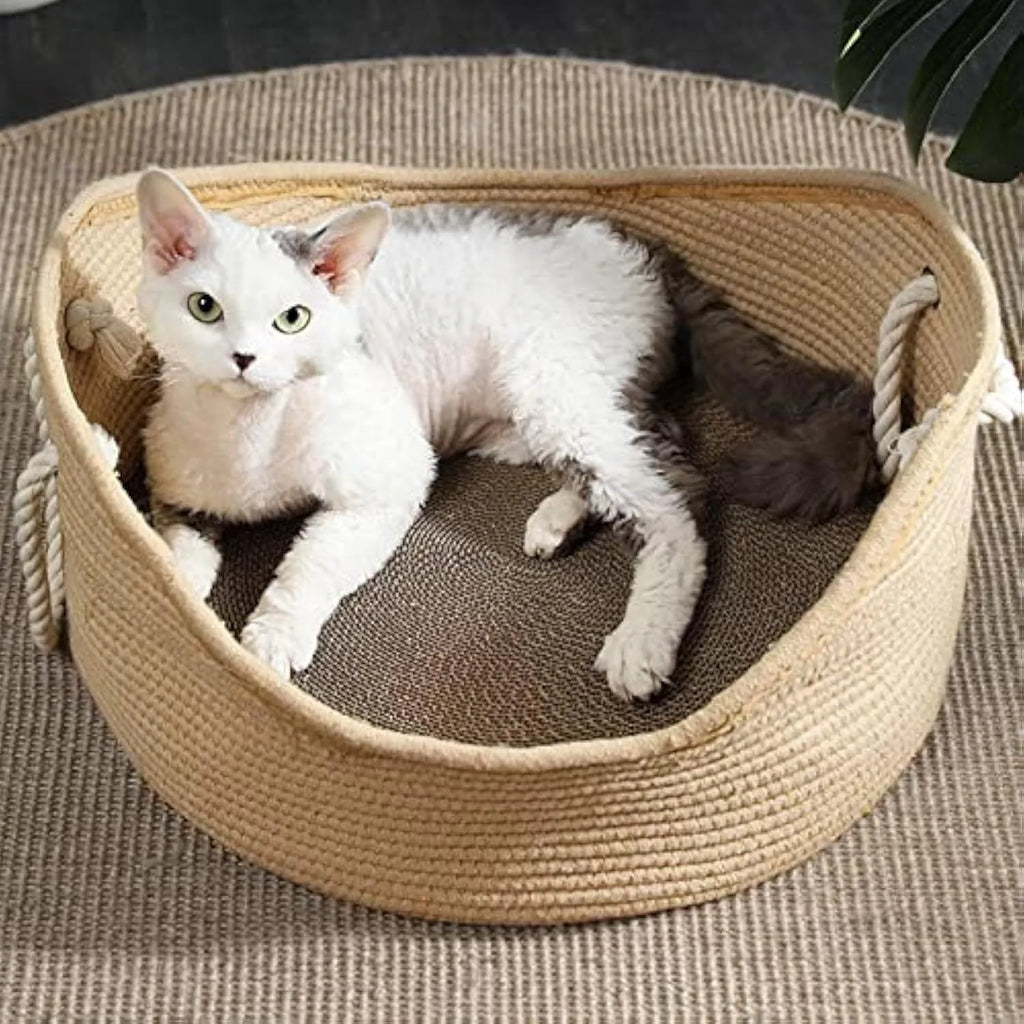 A rectangular wicker cat bed basket with a corrugated cardboard scratching surface on its side.
