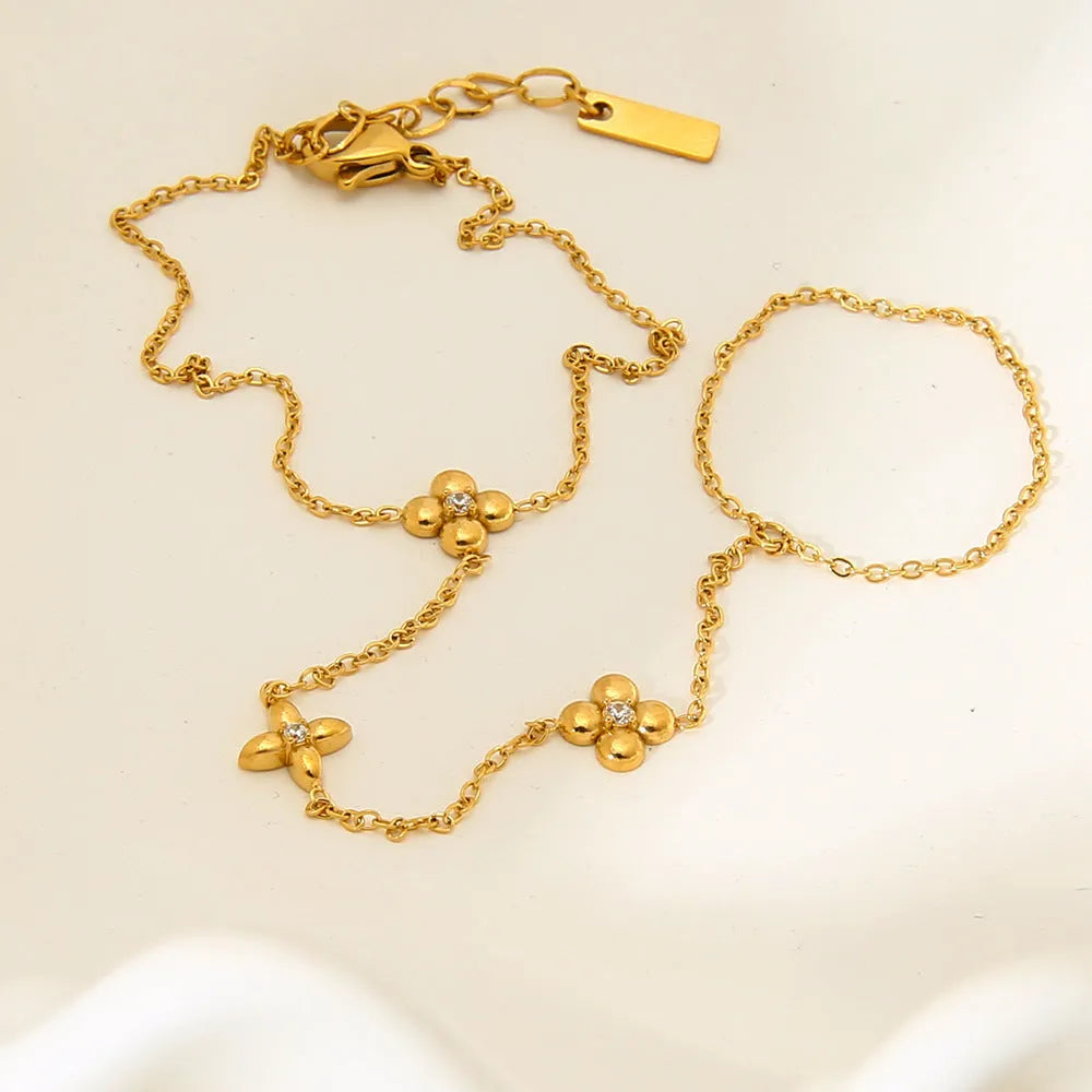 Gold stainless steel bracelet with geometric flower and octagonal star design