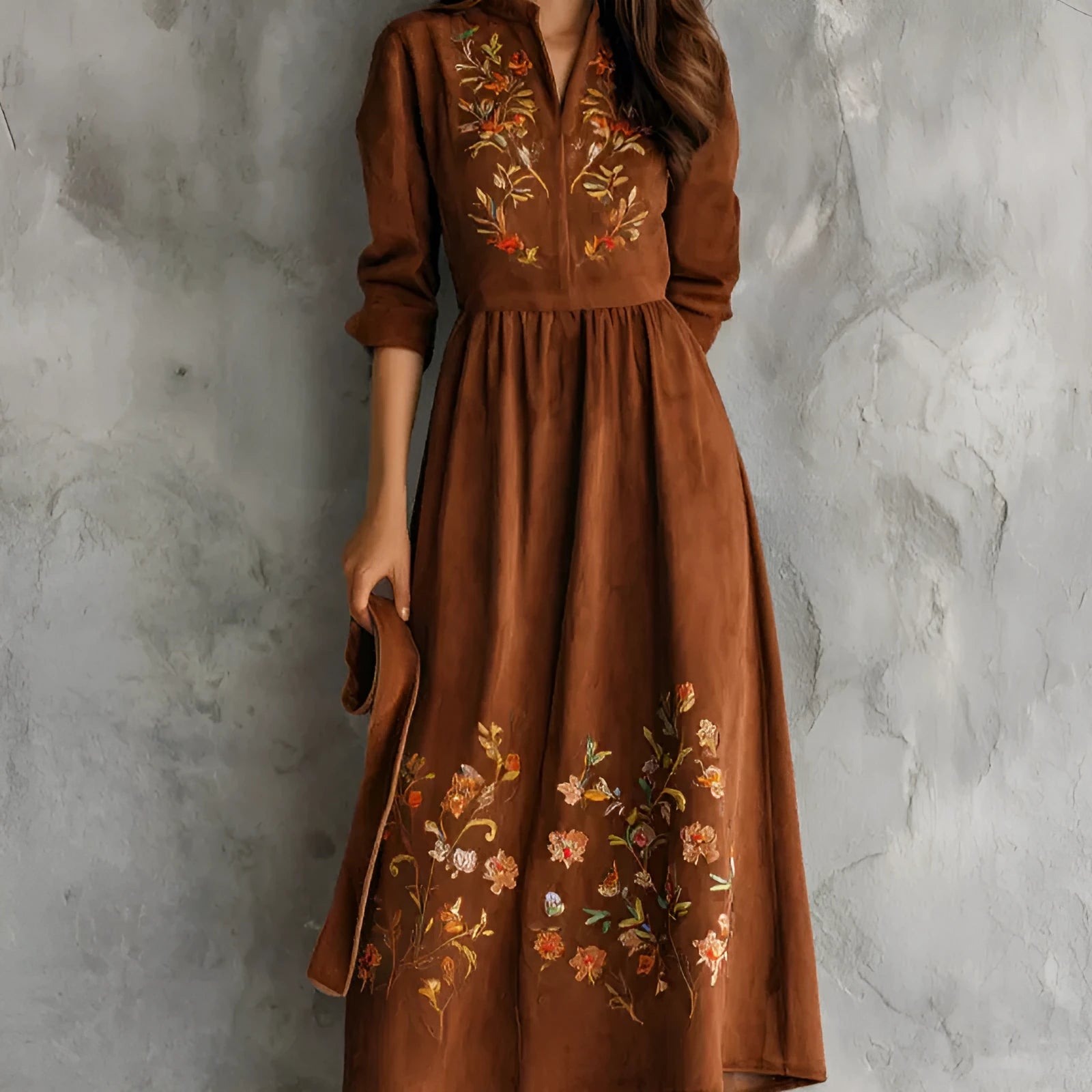 Brown polyester midi dress with floral embroidery detail and long sleeves on a hanger.