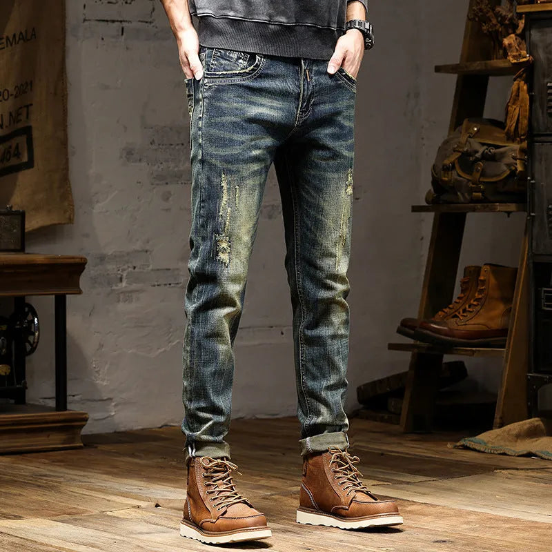 Man wearing skinny fit retro blue jeans with a zip fly, showcasing the casual pencil pants style.