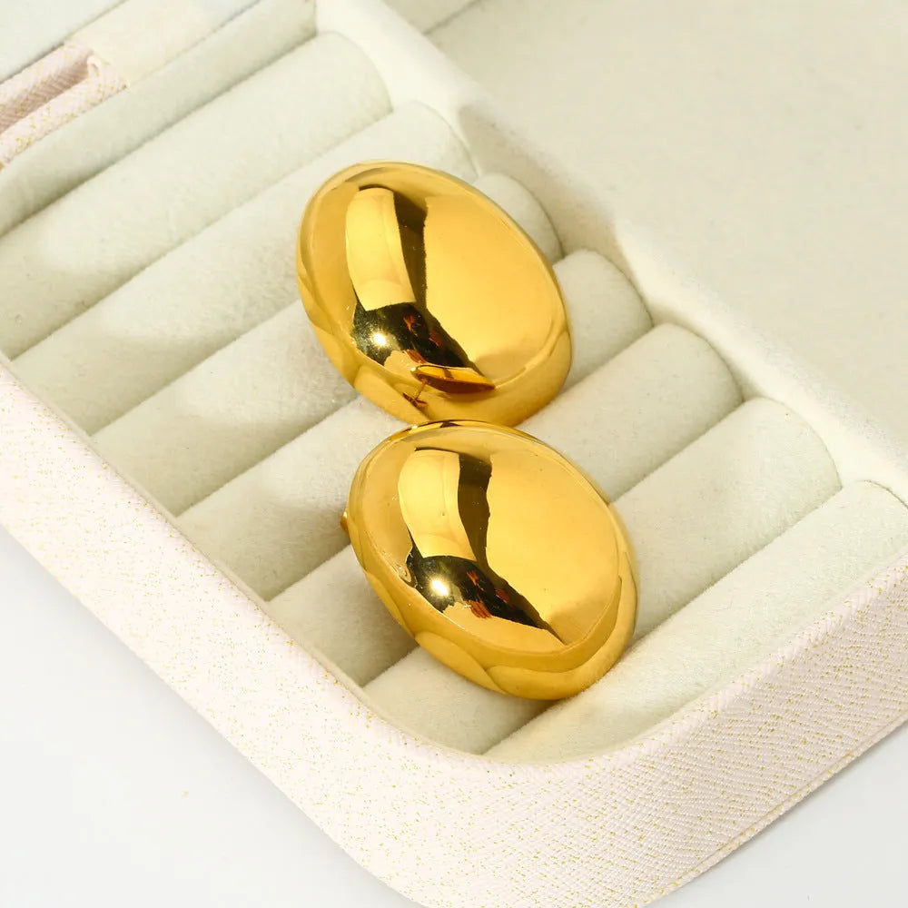 Geometric stainless steel ear studs with exaggerated glazed surface in DFE139 colour