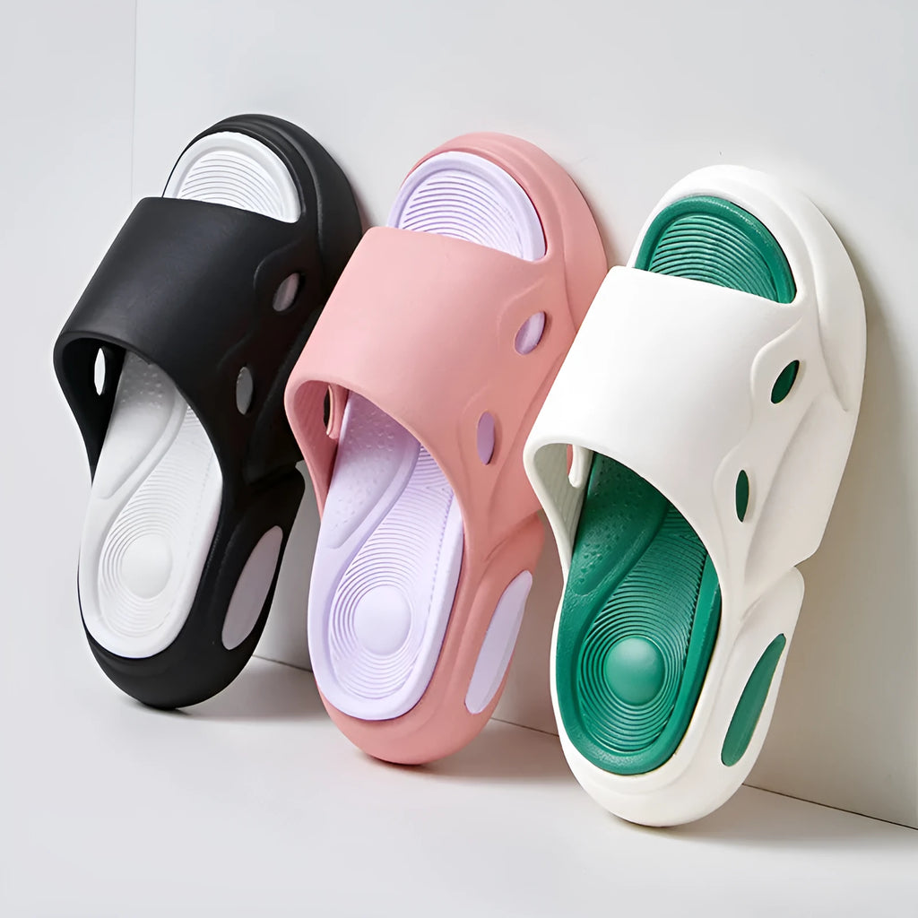 Women's and men's two-colour thick-soled EVA slippers with leather lining on a beach