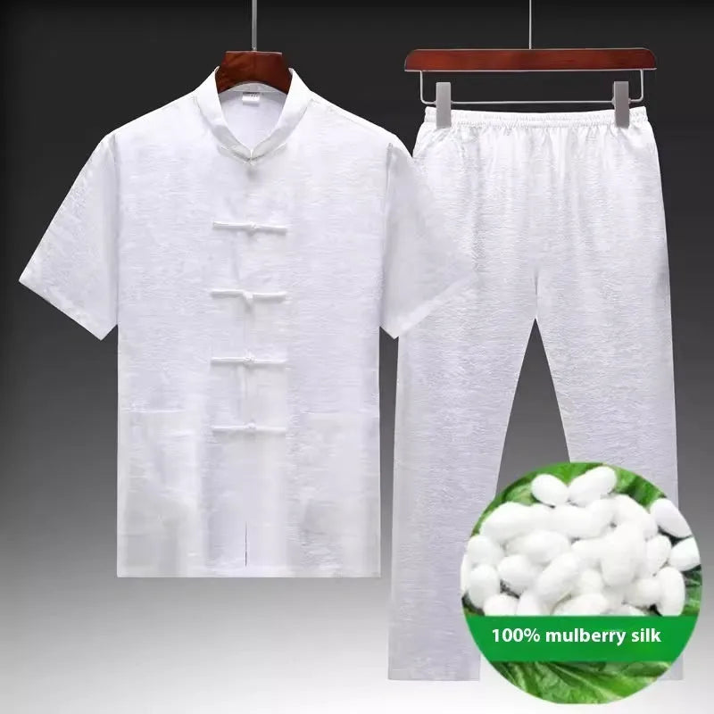 Men's mulberry silk Chinese Tang suit in light green, shown with traditional woven detailing.