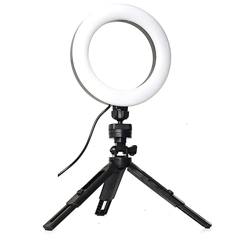 Black desktop tripod with phone bracket and adjustable fill light for mobile video recording
