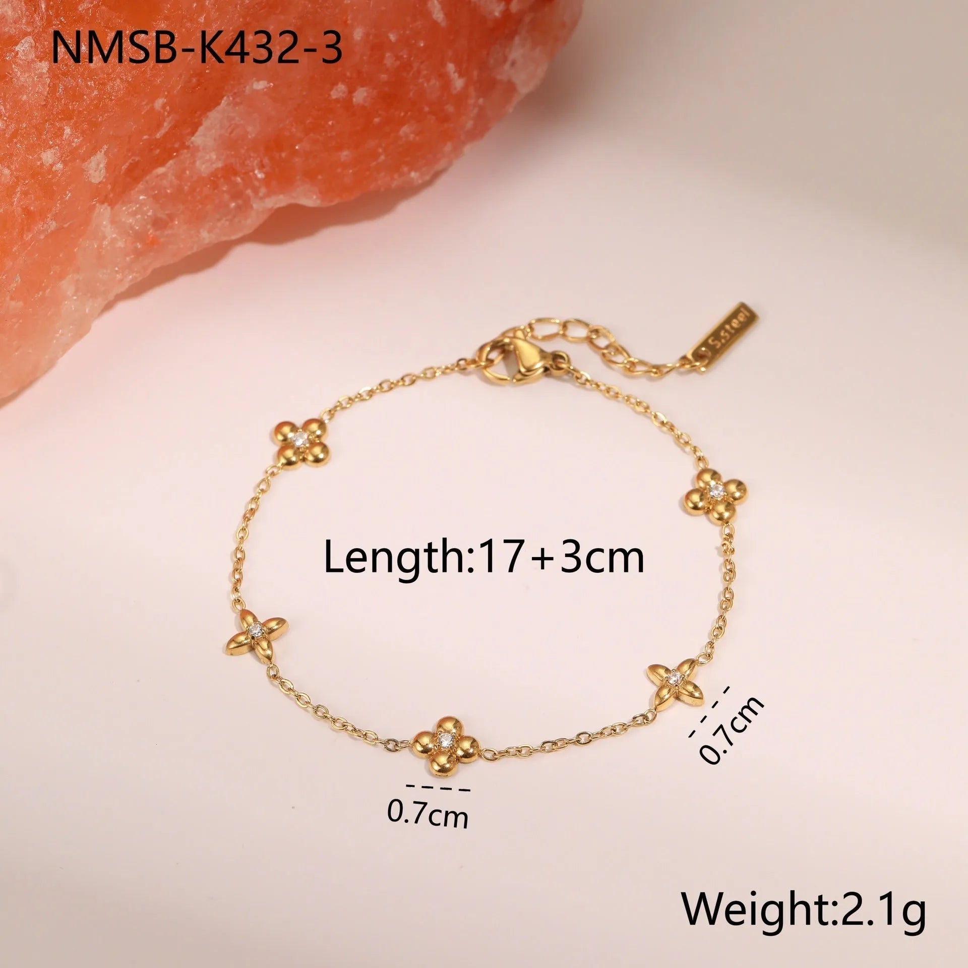 Women's titanium steel bracelet with gold plating and geometric star pendant