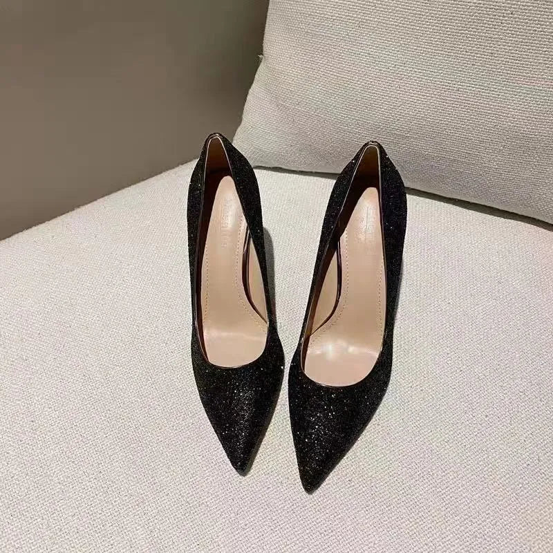 Women's silver and black crystal bridal shoes with stiletto and low heels on a size chart.