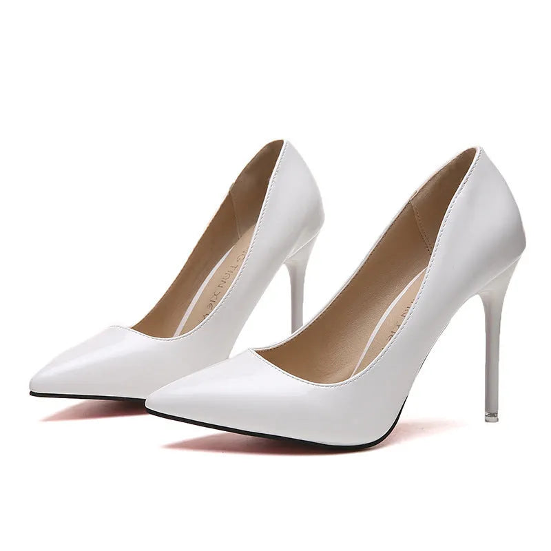 Women's pointed toe pumps with a high stiletto heel in apricot colour on a rubber sole.
