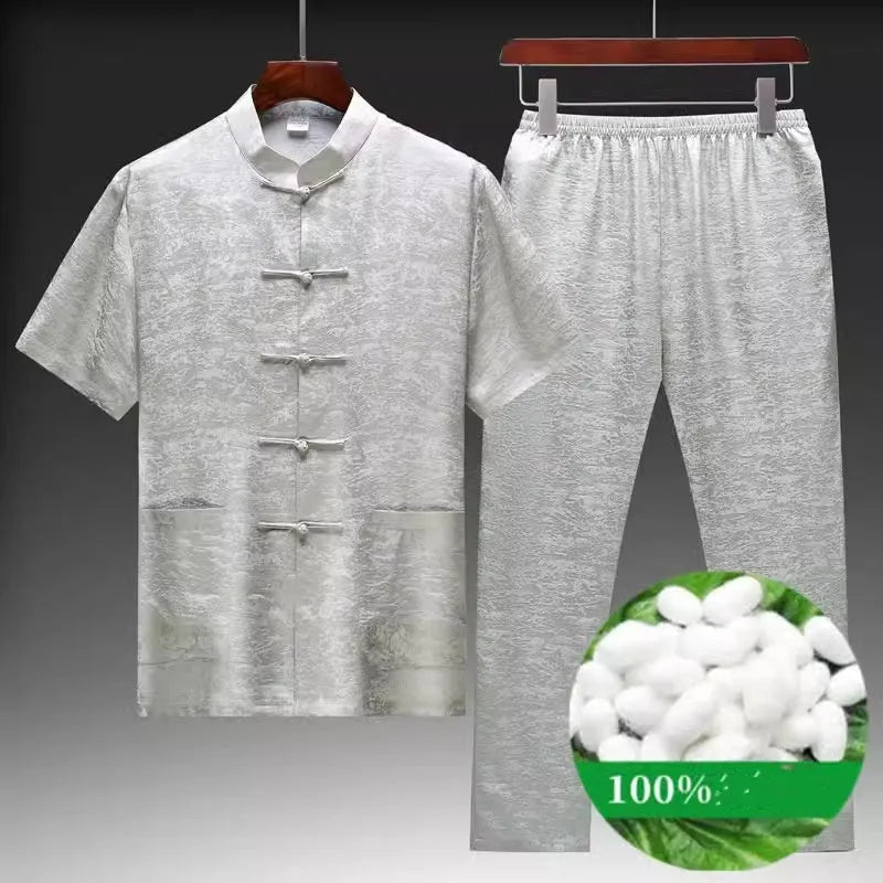 Men's mulberry silk Chinese Tang suit in light green, shown with traditional woven detailing.