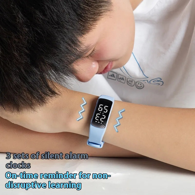 Vibration alarm smart watch with LED display on a silicone strap, shown in a choice of colours.