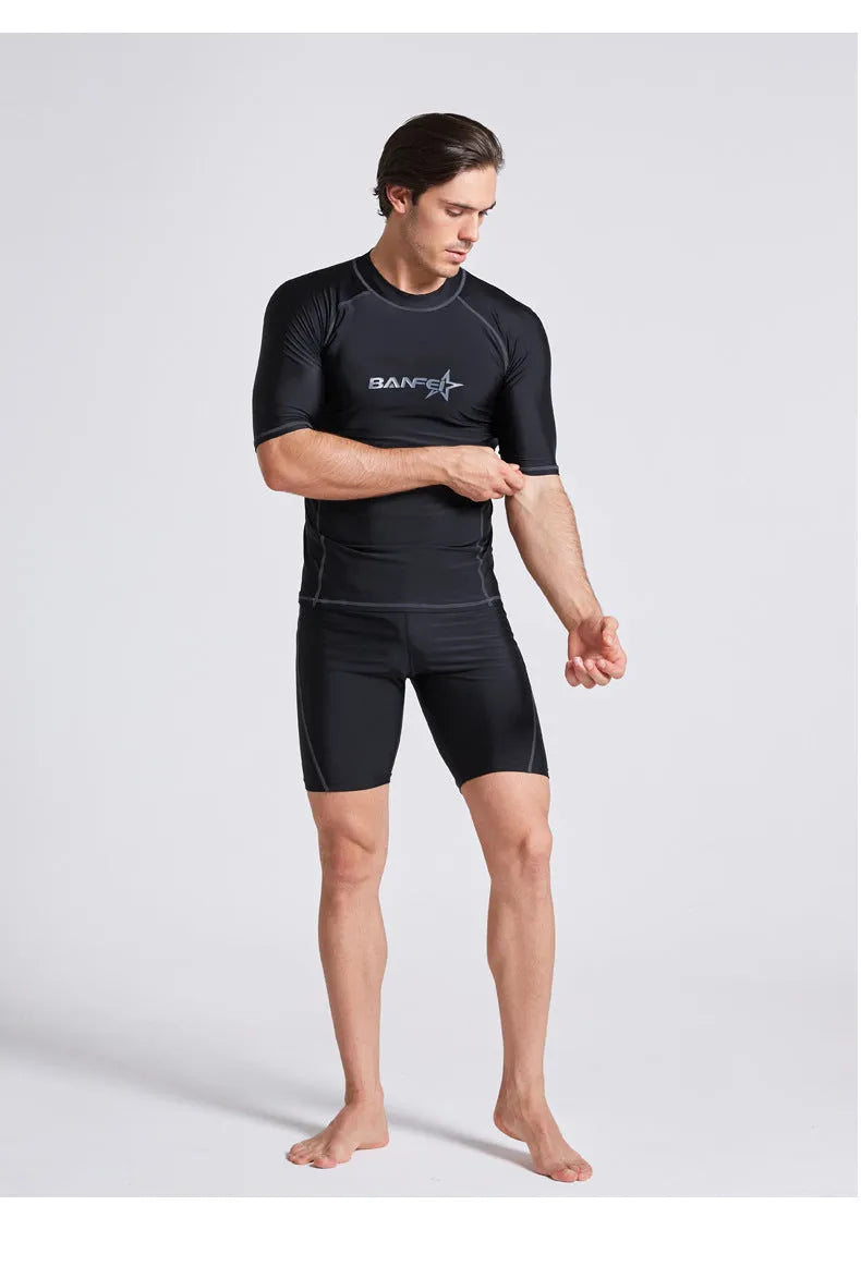 Men's quick-drying half sleeve swim suit with separate swim top and pants in navy blue.