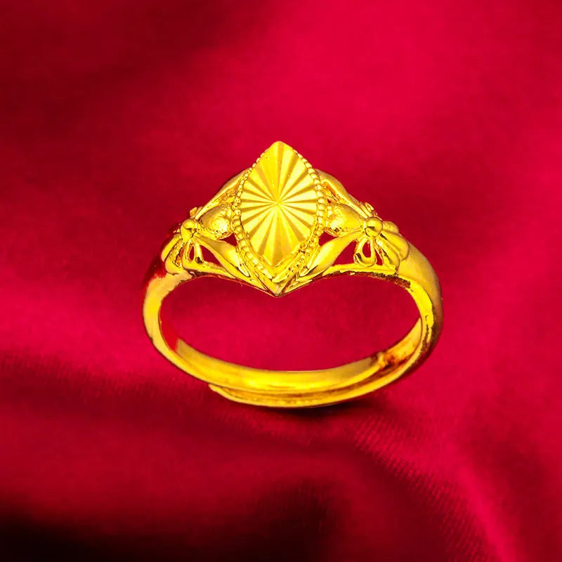 Gold geometric flower ring with textured brass construction and open diamond design