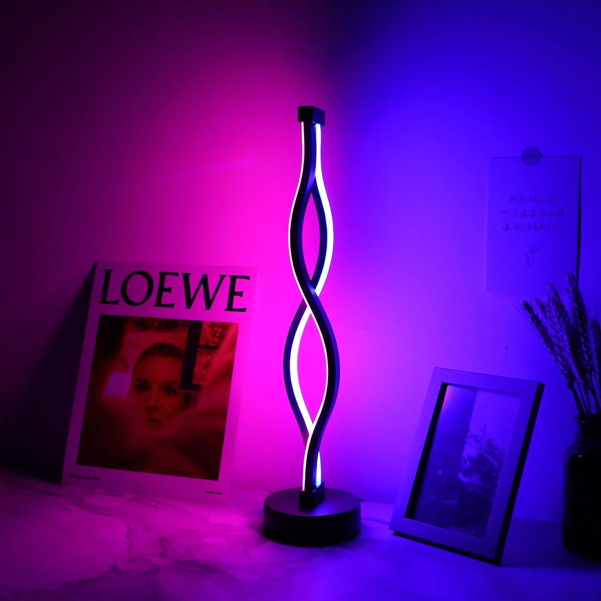 Black aluminium desk lamp with three-colour dimming button and touch controls on desktop