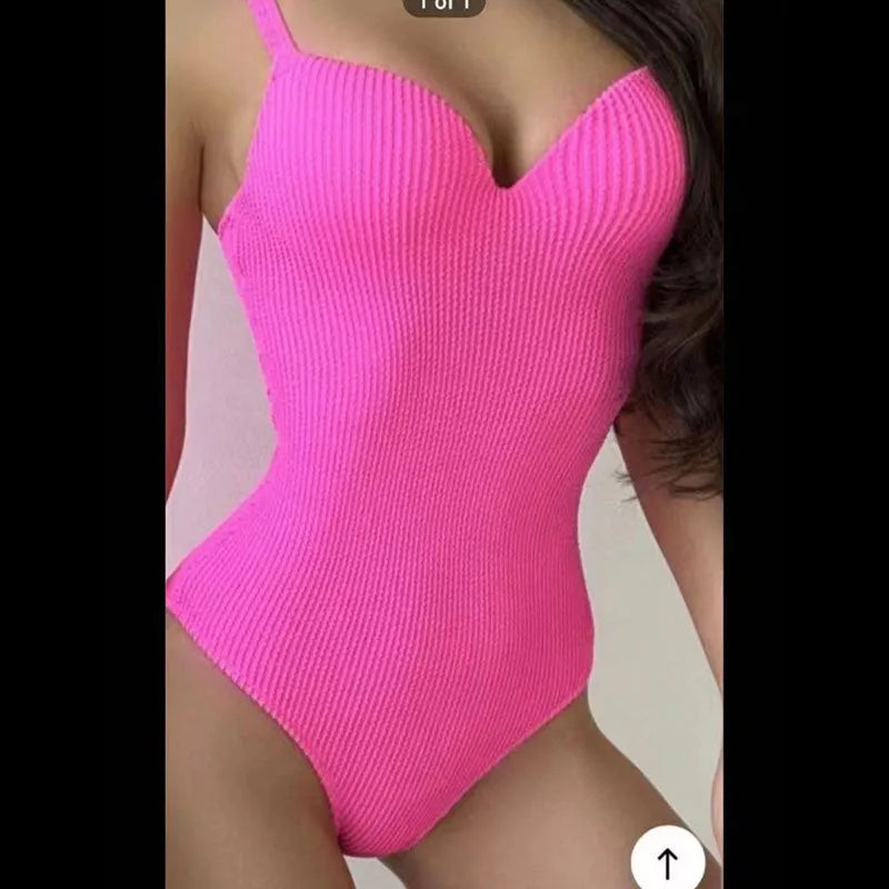 Women's black one-piece sleeveless swimsuit with a sunken stripe pattern on a mannequin.