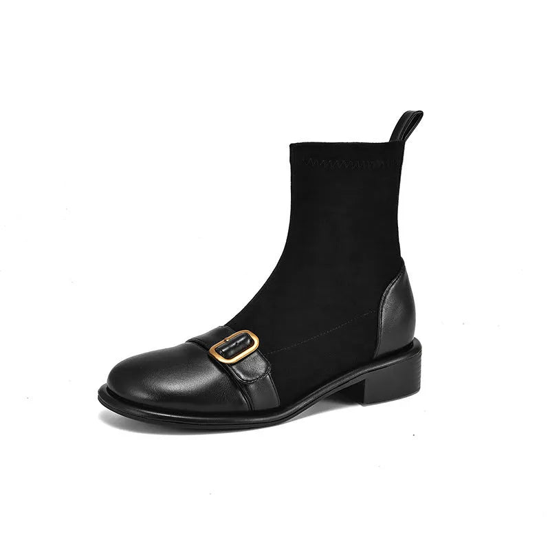 Women's black casual Martin ankle boots with lace-up front and buckle stitching detail on a low heel.