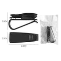 Black plastic clip for holding glasses and cards on a car sun visor.