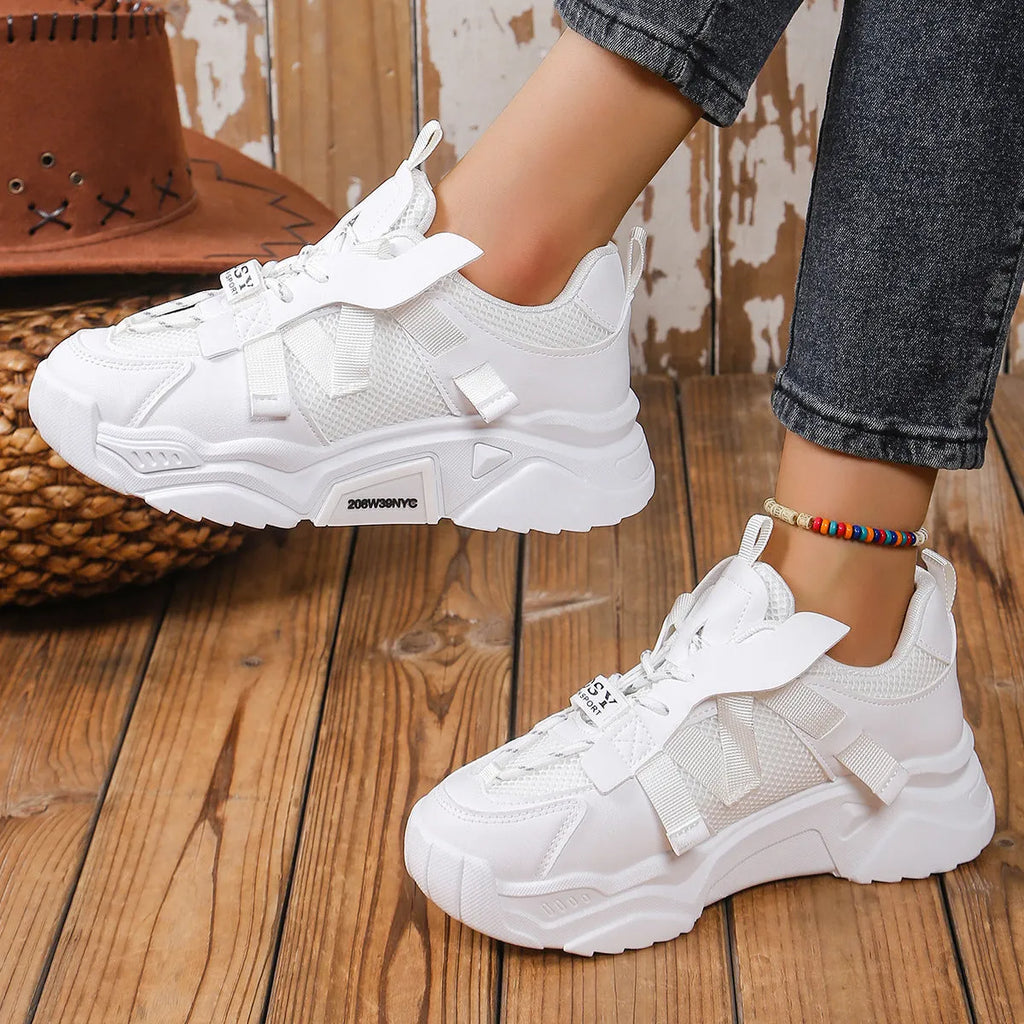 Women's purple platform mesh sports shoe with lace-up front and thick sole for height increase.
