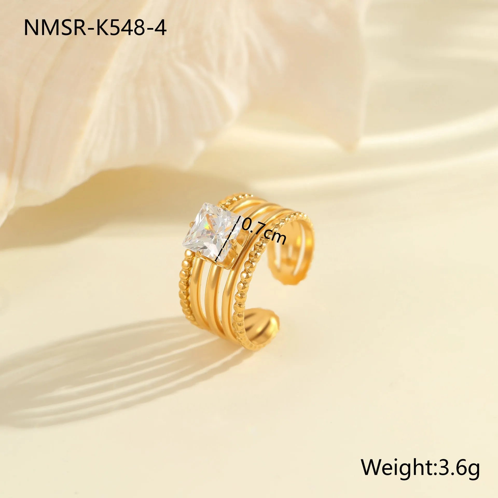 Gold electroplated stainless steel ring with zircon geometric design and open mouth adjustable fit