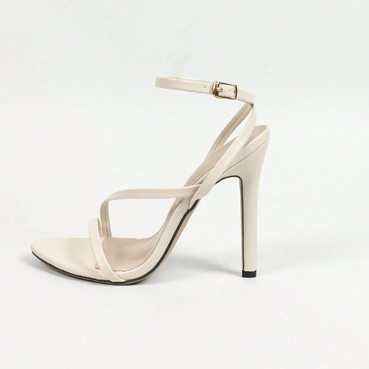 Gold women's open toe high heels with multi-stripe design and cross ankle strap on a white background.