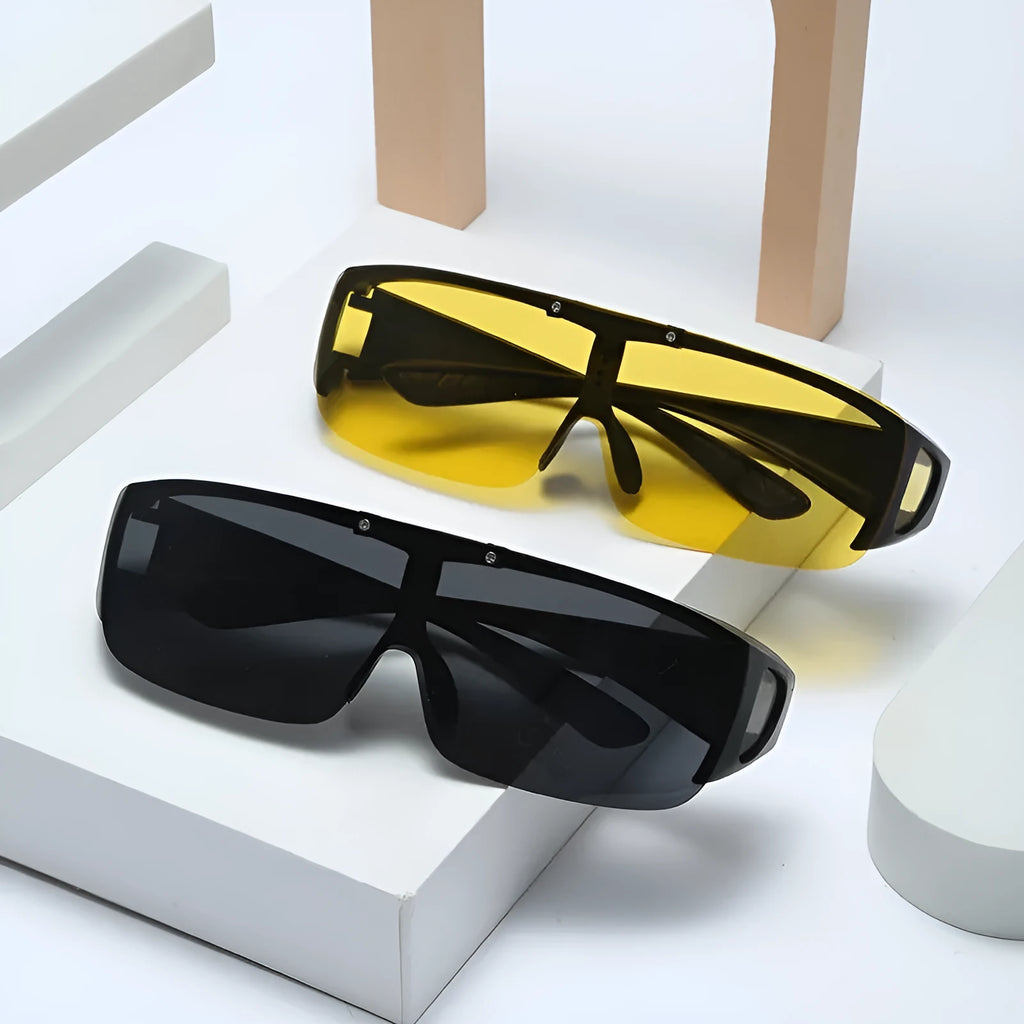 Sporty polarised myopia sunglasses with multiple interchangeable lenses including black, grey, and night vision, on a dark background.
