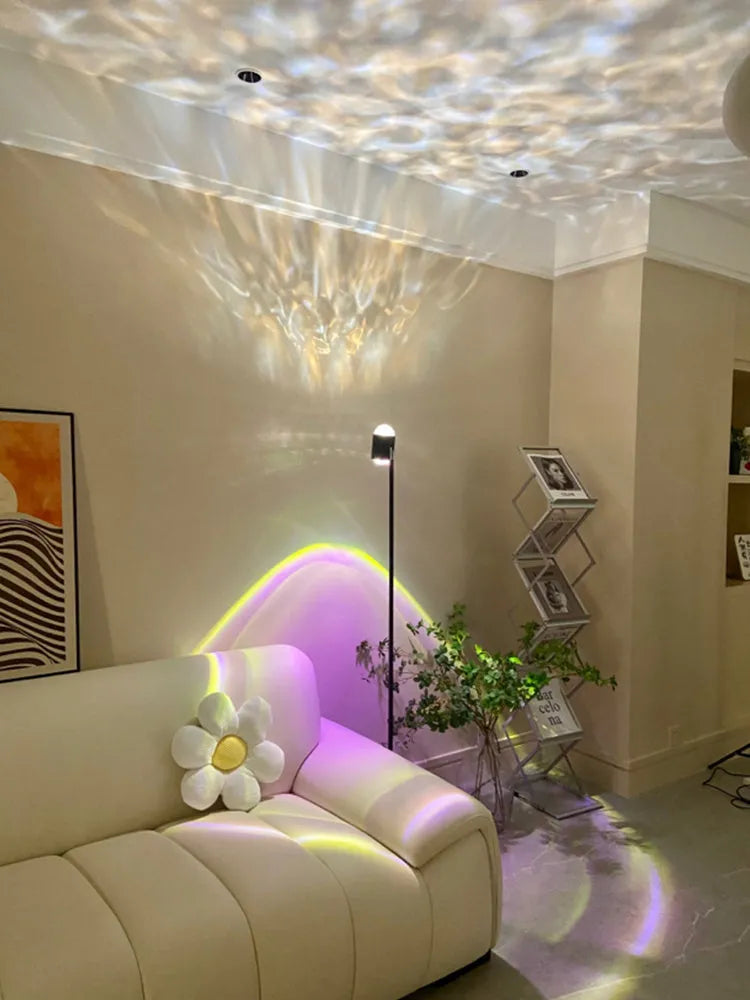 Sunset red modern floor lamp projecting water wave light pattern on floor in a living room.
