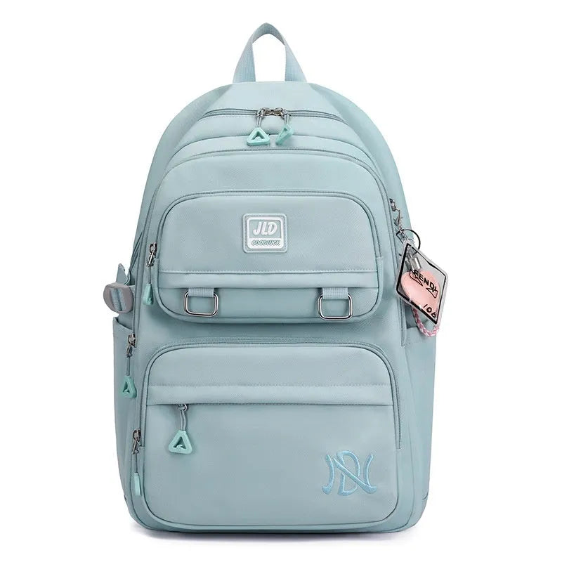 Large purple girls' nylon school backpack with a physiological curve backpanel on a white background.