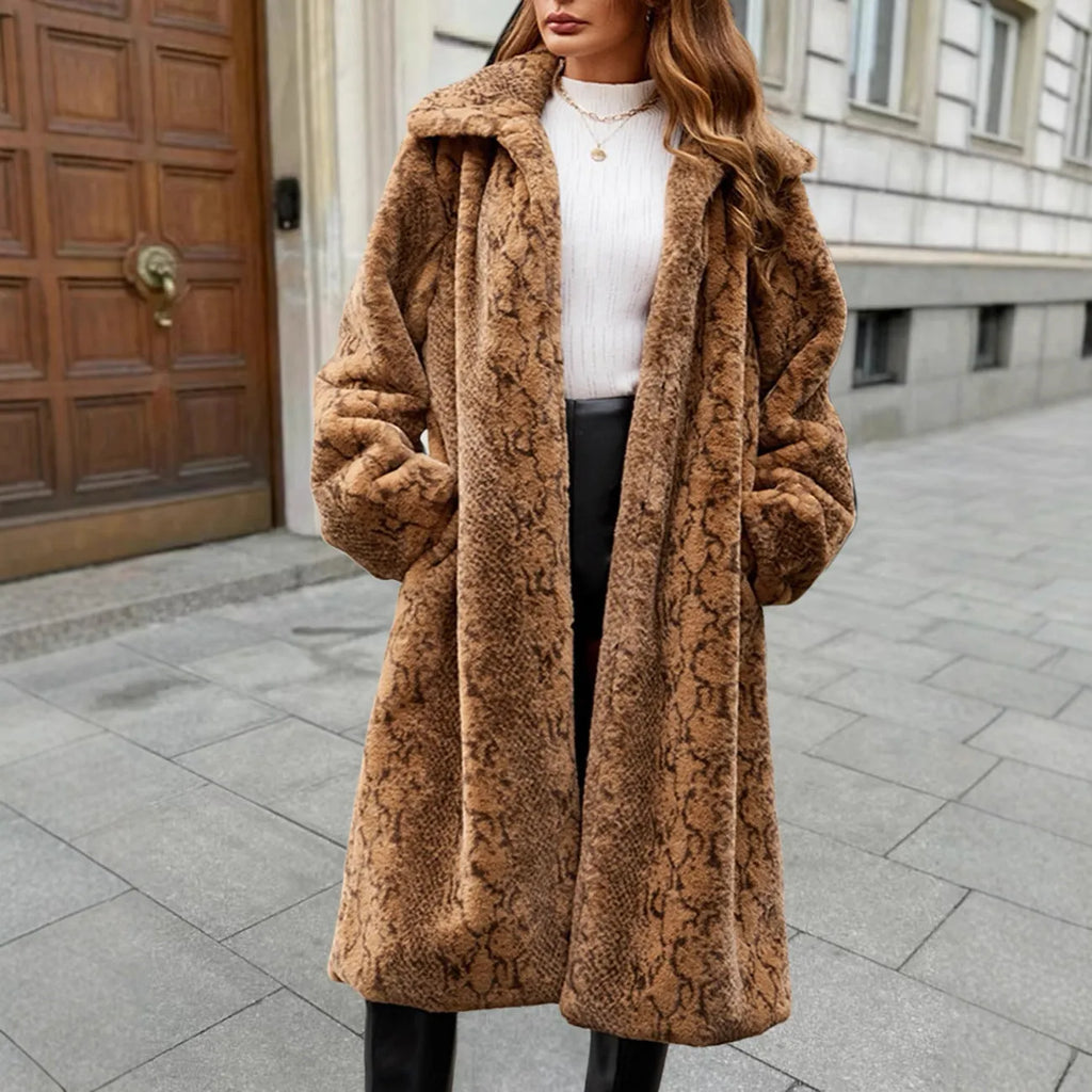 Woman wearing a thick white leopard print faux fur coat with regular sleeves and an 80cm length.