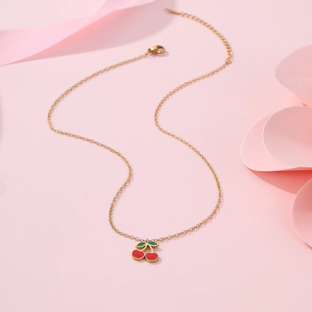 Complete cherry jewellery set showing stainless steel necklace, bracelet, earrings and ring with 18K electroplated finish