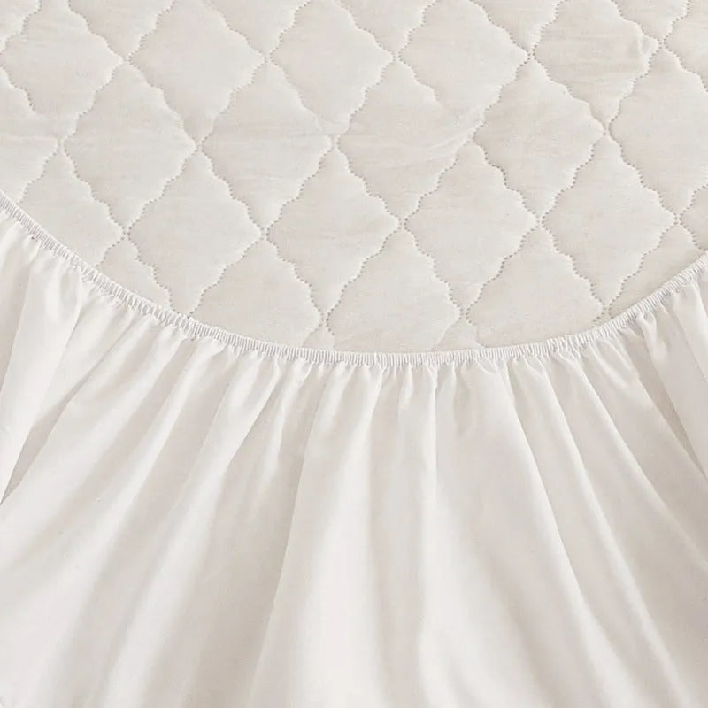 Diamond lattice quilted waterproof mattress protector set with bamboo fibre fitted sheet and pillowcases.