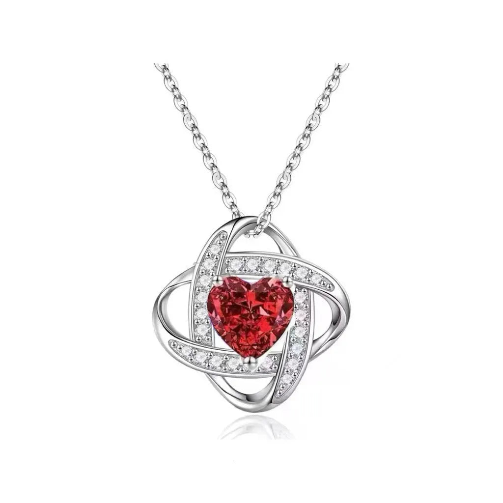 Copper heart necklace with electroplated platinum finish showing multiple colour variations