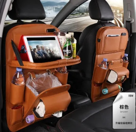PU leather car storage bag hanging on seat back with multiple pockets and built-in trash can