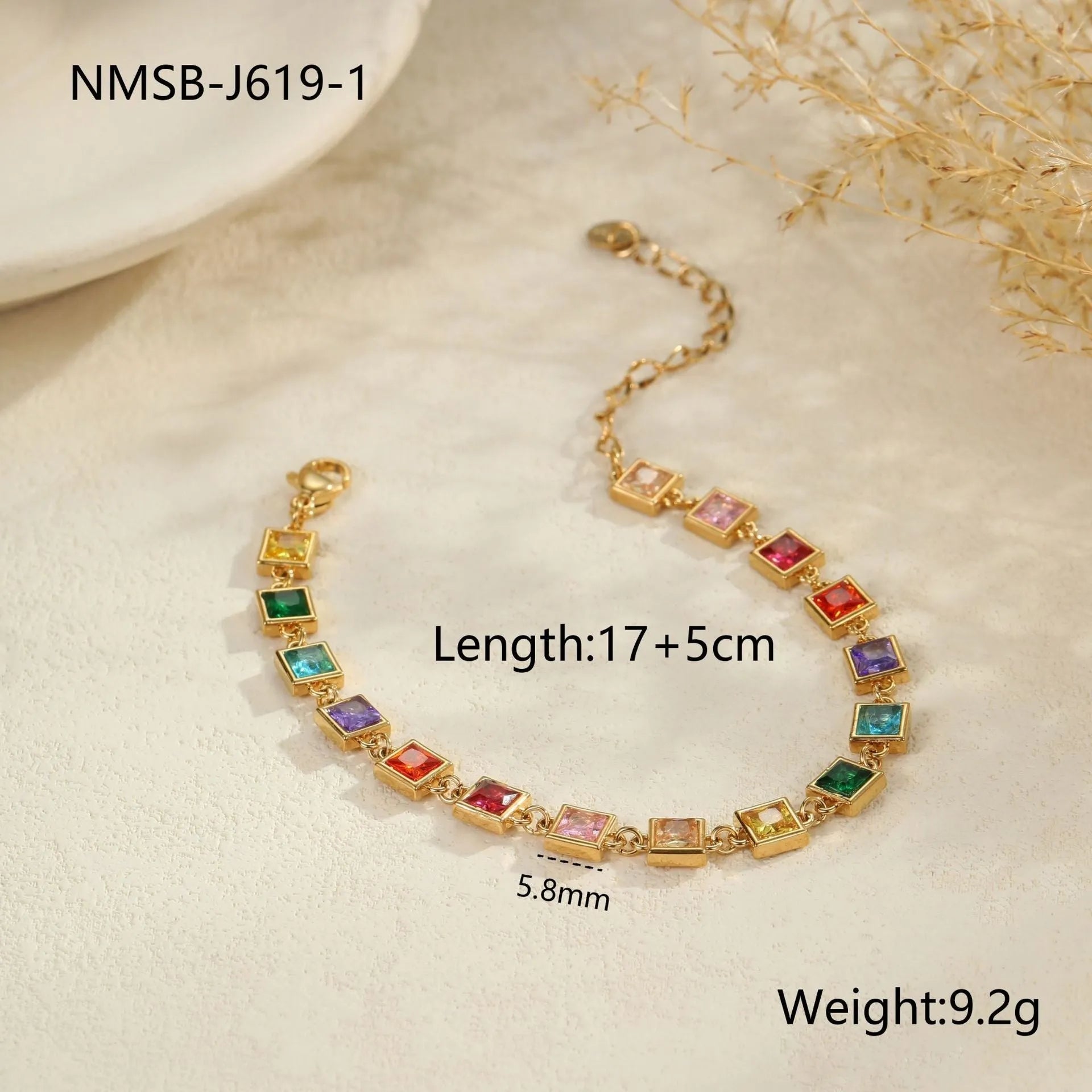 Gold and silver electroplated stainless steel bracelet with square, heart, and round geometric designs