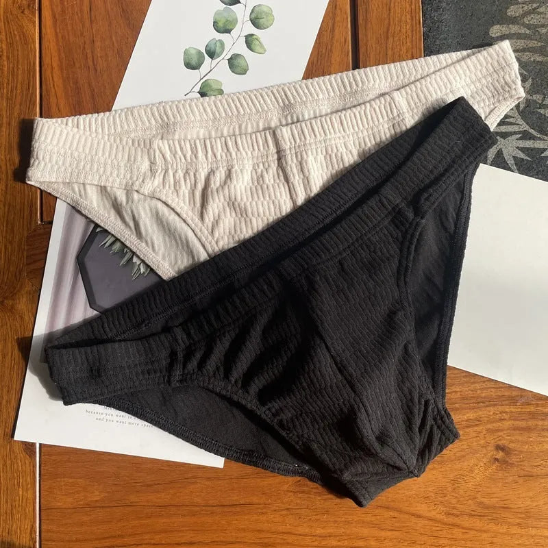 Men's solid colour cotton triangle underwear briefs with mid waistband, shown in apricot black colour.