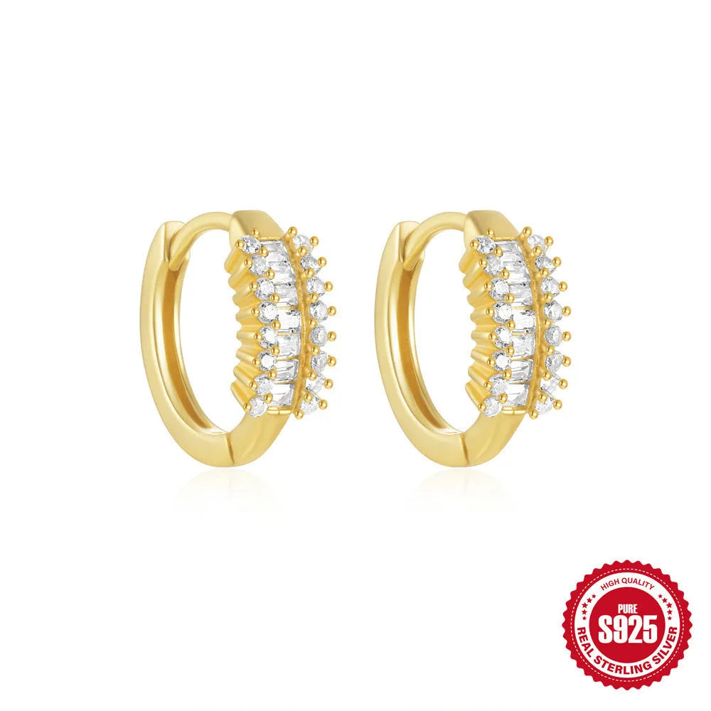 Sterling silver geometric stud earrings with small round diamond detailing in gold and silver electroplated finishes