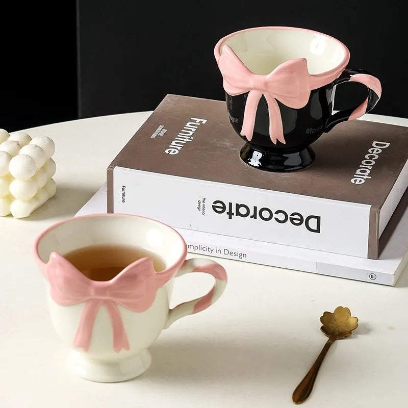 Ceramic mug with heart bow design in Black Pink colour, 301-400ml capacity.