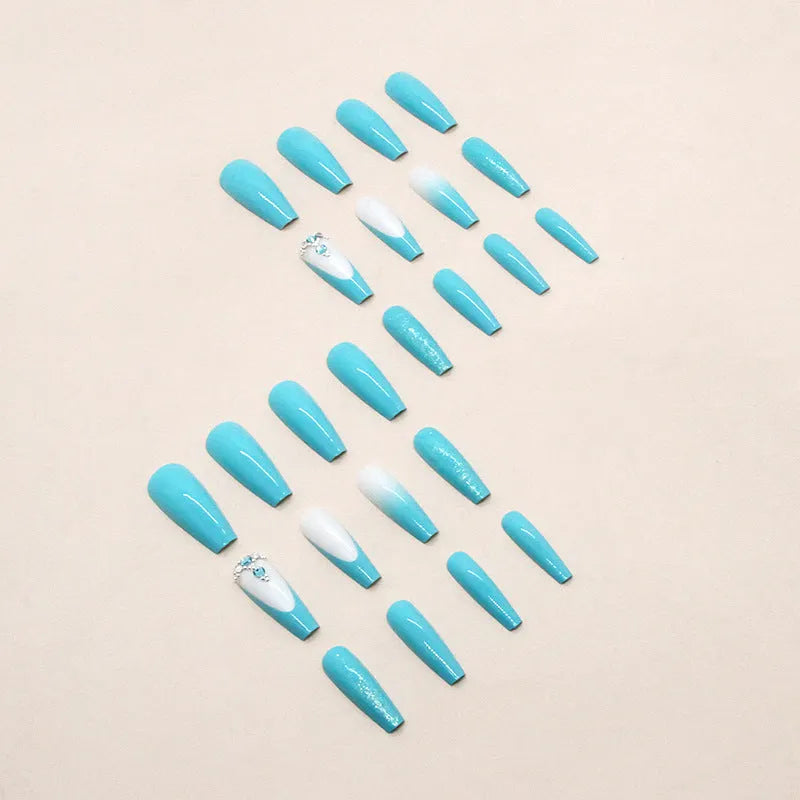 Long ballet shape artificial nails in solid smart blue diamond colour with nail glue bottle.