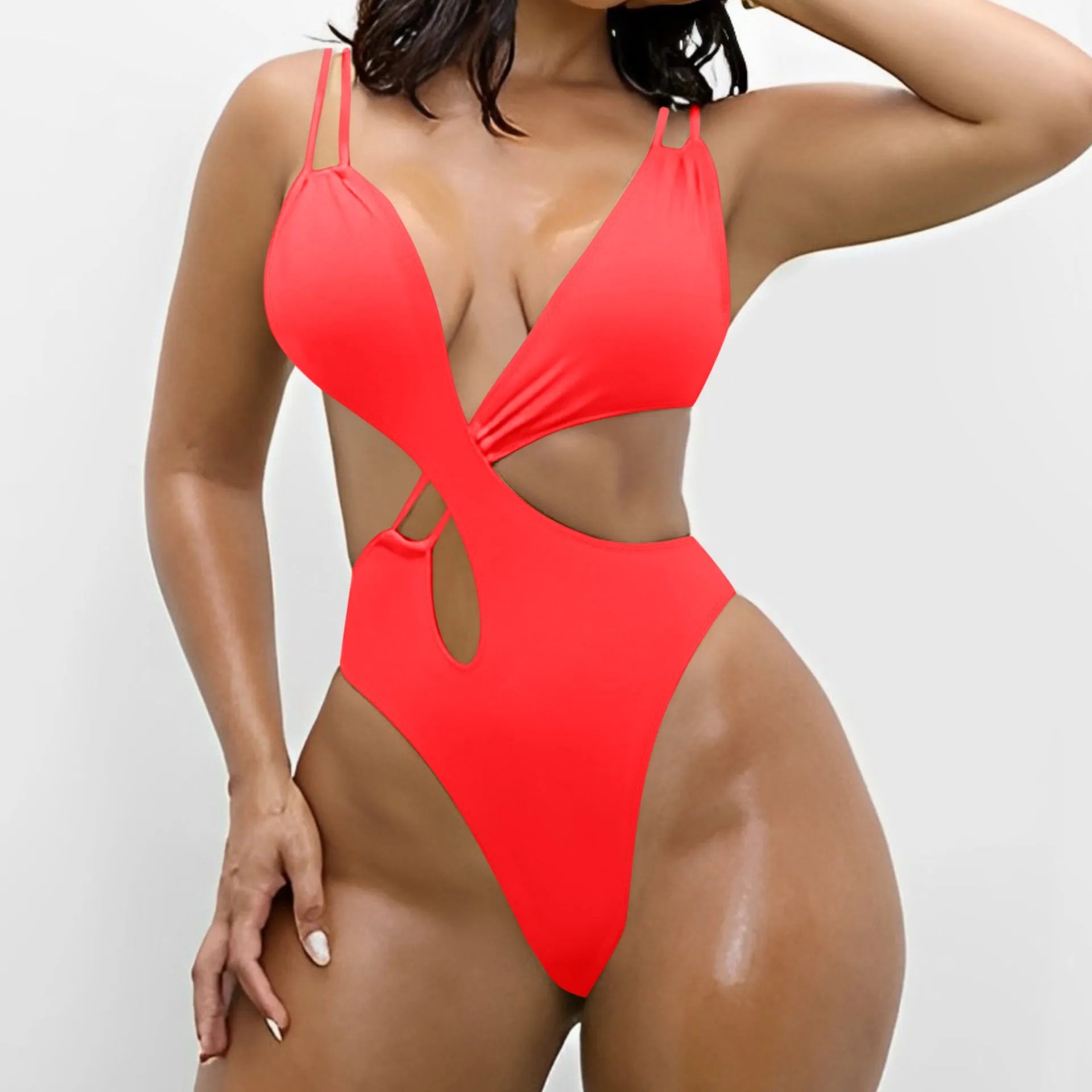 Women's solid colour backless one-piece triangle swimsuit in nylon on a mannequin.