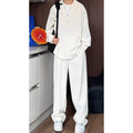 Men's black slim fit polo shirt and trousers two-piece casual suit on a hanger.