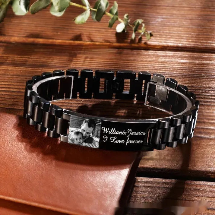 Men's titanium steel curved heart shape bracelet with black lettering.