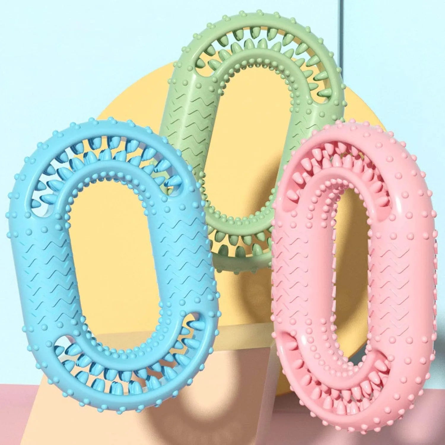 Blue O-ring shaped dog chew toy for aggressive chewers on a plain background.